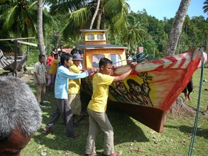 Pulling the boat towards the water