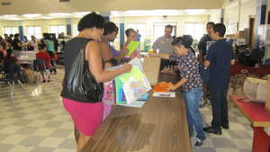 Hindu Charity Volunteer helps distribute Supplies