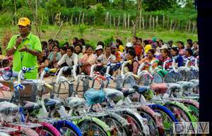 Sedtha standing amongst the bicycle donations