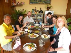 Sedtha having lunch with workers at the center