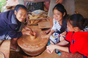 Making a clay pot at the Pottery Village
