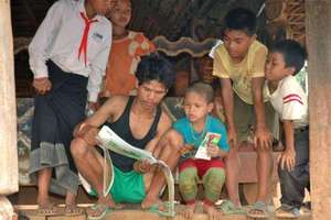 Bringing books to villagers during research trip