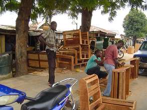 Beneficiaries working in carpentry workshop