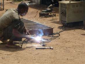 Welding beneficiary concentrateing on his job