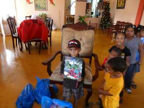 Children receive their Christmas toys