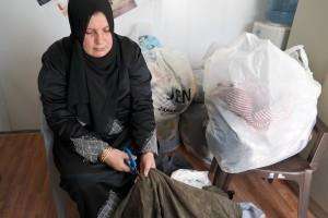 A lady was creating recycling clothes