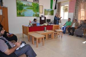 Hygiene promoter giving her class