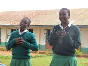 Students singing in the schoolyard, Kenya