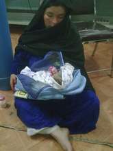 New mother with her baby in Embrace