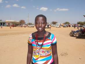 New scholarship winner Felister at Mile 46 Market
