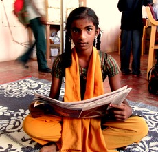 Ponmani reading alound the local English newspaper
