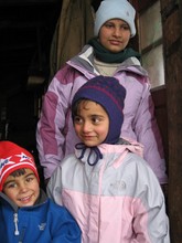 Photo-- Three children with new jackets and hats