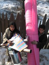 Photo-- family receiving goods