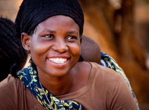 Esme, in her 4th loan cycle, sells rice