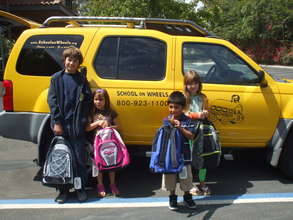 Students receiving backpacks