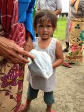 Typhoon child with AAI food for family