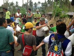 chain of aid workers AAI and IPI deliver food