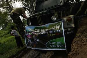 huge army truck stuck in mud on AAI relief mission