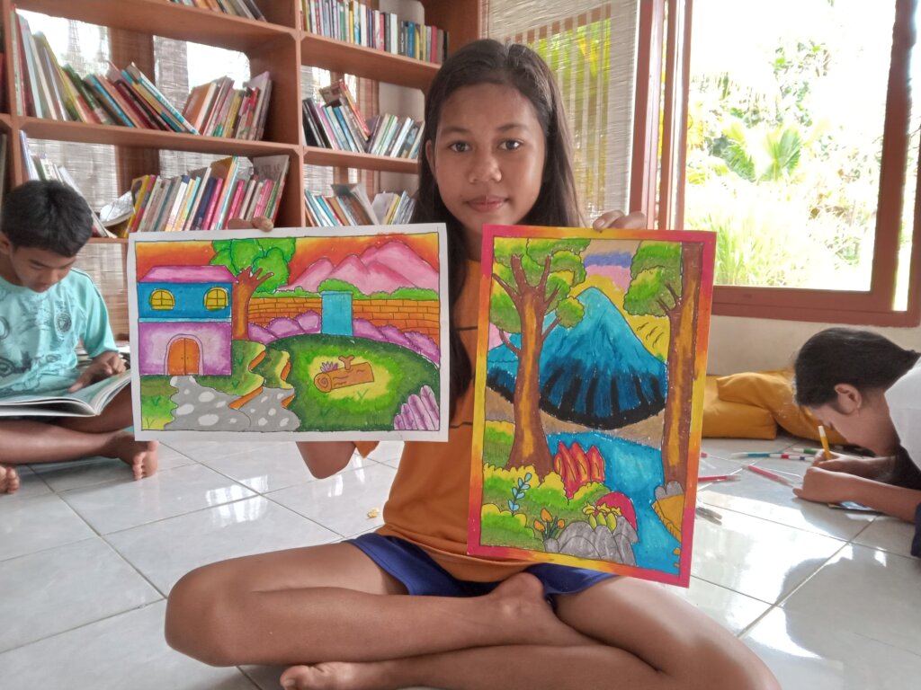 She proudly shows her drawing
