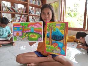 She proudly shows her drawing