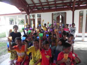 Drinking milk together at YUM Kalimantan Library