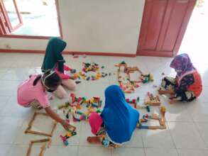 Small children playing with blocks