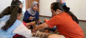 The girls preparing chocolate jelly for sale