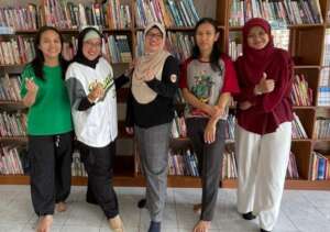 With YUM's donor representative and volunteer