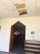 The flaking ceiling above the door