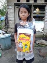 The girl with home learning package+a box of milk