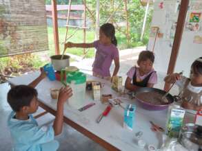 The library members enjoy making the pudding