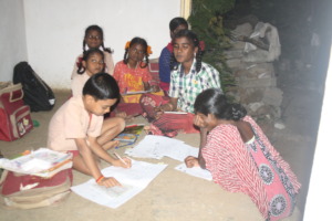 Selvi with a group, getting coaching