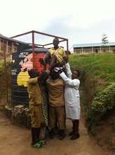 P6 Students & Teacher Lifting High-Performer