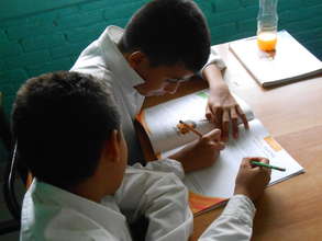Students using the IMIFAP workbooks