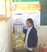 Girl consuming safe drinking water from a filter