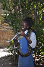 Grace at the reptile park holding a snake.
