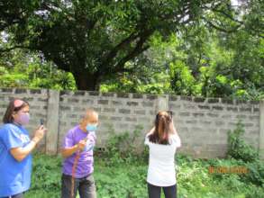 Ka Noli and others inspect the new wall