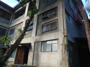 Facade C before December, with top windows missing