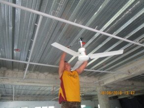 Installing curtain rails and fans