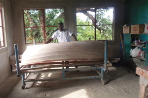 Drissa in the new boat workshop you've provided