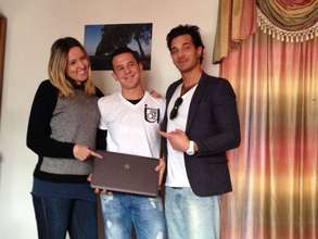 Mirzet, our scholarship studen receives his laptop