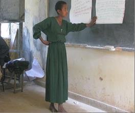 Beneficiary presenting to a group at a training.