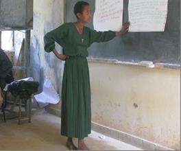 Beneficiary presenting to a group at a training.