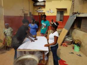 Young Mothers Working Along With Their Mentor