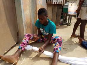 One Of The Young Mothers Preparing Cloth For Dying