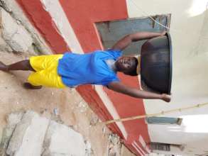 A Young Mother Fetches Water For The Process