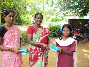 Student receiving Dictionary