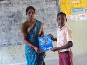 Student receiving atlas