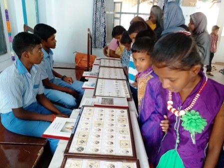 Looking at the coins with astonishment