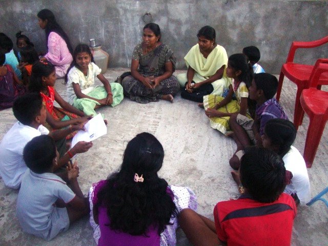 Coaching 100 school children in studies in India